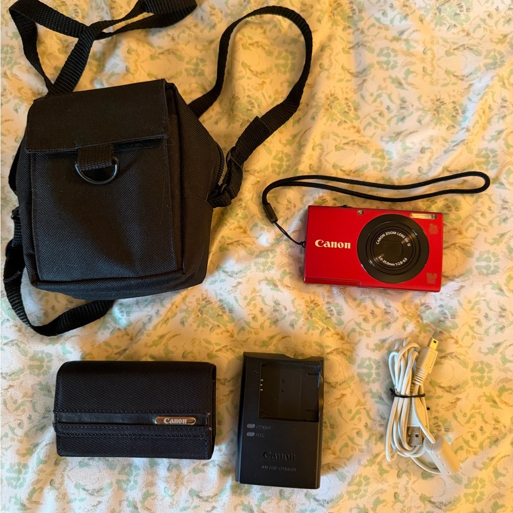 Canon Red Digital Camera with Black Accessories